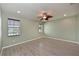 Comfortable bedroom with a ceiling fan and two windows providing natural light at 11342 77Th E St, Parrish, FL 34219