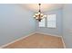 Bright dining room with neutral paint, tile flooring, and a chandelier at 11342 77Th E St, Parrish, FL 34219