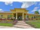 Attractive clubhouse exterior with beautiful landscaping and inviting entrance at 11342 77Th E St, Parrish, FL 34219
