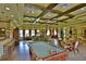 Well-appointed game room in the clubhouse with a pool table and seating areas at 11342 77Th E St, Parrish, FL 34219