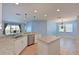 Modern kitchen with granite countertops, stainless steel appliances, and an island at 11342 77Th E St, Parrish, FL 34219