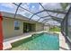 Backyard pool and spa area with screened-in enclosure at 11342 77Th E St, Parrish, FL 34219