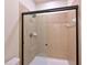 Tiled shower with a glass door and modern fixtures, creating a clean and functional space at 11342 77Th E St, Parrish, FL 34219