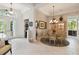 Spacious dining area featuring tile floors, elegant lighting, and easy access to foyer at 12240 Thornhill Ct, Lakewood Ranch, FL 34202