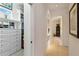 Hallway with closet, doorway to the bathroom, and tile floors at 12240 Thornhill Ct, Lakewood Ranch, FL 34202
