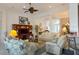 Inviting living room with cozy seating, built-in shelving, and seamless flow to other living spaces at 12240 Thornhill Ct, Lakewood Ranch, FL 34202