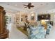Open concept living area featuring high ceilings, tiled floors, and an abundance of natural light at 12240 Thornhill Ct, Lakewood Ranch, FL 34202