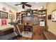 Home office complete with built-in shelving, cabinets, and a treadmill at 12240 Thornhill Ct, Lakewood Ranch, FL 34202
