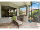Screened outdoor kitchen with built-in grill, stainless steel drawers, and beautiful tile flooring, perfect for entertaining at 12240 Thornhill Ct, Lakewood Ranch, FL 34202