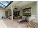 Outdoor patio with stylish lounge chairs and seating areas under a screened lanai at 12240 Thornhill Ct, Lakewood Ranch, FL 34202