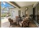 Inviting screened patio with comfortable seating, creating a relaxing outdoor living space perfect for enjoying the outdoors at 12240 Thornhill Ct, Lakewood Ranch, FL 34202