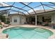 Inviting screened-in pool area with brick pavers, steps into the pool and comfortable lounge seating at 12240 Thornhill Ct, Lakewood Ranch, FL 34202