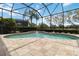 Enclosed swimming pool with brick paved patio, complemented by manicured hedges providing a tranquil outdoor retreat at 12240 Thornhill Ct, Lakewood Ranch, FL 34202