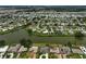 A view of the neighborhood including the lake and houses at 1227 Waterside Ln, Venice, FL 34285