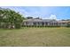 Spacious backyard featuring a screened-in patio area at 1227 Waterside Ln, Venice, FL 34285