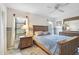 Comfortable bedroom with ample natural light, neutral walls, and a ceiling fan at 1227 Waterside Ln, Venice, FL 34285