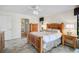 Bedroom offers tile floors, wooden furniture, recessed lighting and closet at 1227 Waterside Ln, Venice, FL 34285