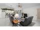 Comfortable living room adjacent to kitchen with pool view and comfortable seating at 1227 Waterside Ln, Venice, FL 34285