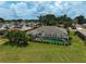 Aerial view of a home with a screened-in pool, showcasing the backyard at 1227 Waterside Ln, Venice, FL 34285