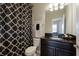 The half bathroom features a modern vanity and neutral decor at 13706 American Prairie Pl, Lakewood Ranch, FL 34211