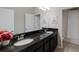 Bathroom features a double sink vanity with granite counters at 13706 American Prairie Pl, Lakewood Ranch, FL 34211