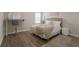 Bright bedroom with a workspace desk, natural light, and modern furniture at 13706 American Prairie Pl, Lakewood Ranch, FL 34211