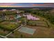 Aerial view of the community amenities, including a park, basketball court, playground, and clubhouse with pool at 13706 American Prairie Pl, Lakewood Ranch, FL 34211