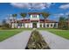Beautiful community center with manicured landscaping, offering a welcoming and attractive space at 13706 American Prairie Pl, Lakewood Ranch, FL 34211