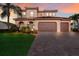 Gorgeous Mediterranean home with a three-car garage and a paved driveway at 13706 American Prairie Pl, Lakewood Ranch, FL 34211
