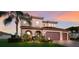 Stunning home with a well-manicured lawn and a welcoming front entrance at 13706 American Prairie Pl, Lakewood Ranch, FL 34211