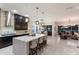 Modern kitchen with a large island, pendant lighting, and an open floor plan at 13706 American Prairie Pl, Lakewood Ranch, FL 34211