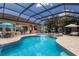Inviting screened-in pool and outdoor seating area, perfect for relaxation and social gatherings at 13706 American Prairie Pl, Lakewood Ranch, FL 34211