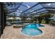 Beautiful screened-in pool area with a spa and ample seating, great for entertaining guests at 13706 American Prairie Pl, Lakewood Ranch, FL 34211