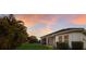 Beautiful backyard with lush landscaping, green lawn and a screened lanai perfect for outdoor relaxation and enjoyment at 13848 American Prairie Pl, Lakewood Ranch, FL 34211