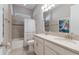 Well-lit bathroom with double vanity, soaking tub, and tiled shower with curtain at 13848 American Prairie Pl, Lakewood Ranch, FL 34211