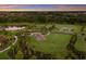 Aerial view of the community park featuring a playground, basketball court, and scenic walking paths at 13848 American Prairie Pl, Lakewood Ranch, FL 34211