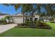 Charming two-story home featuring a well-maintained lawn, mature landscaping, and a two-car garage at 13848 American Prairie Pl, Lakewood Ranch, FL 34211
