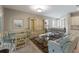 Cozy living room featuring a dining table, stylish furniture, and neutral paint, creating a comfortable and inviting space at 13848 American Prairie Pl, Lakewood Ranch, FL 34211
