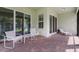 Covered patio with comfortable seating, offering seamless indoor-outdoor living at 13848 American Prairie Pl, Lakewood Ranch, FL 34211