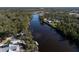 Aerial view of waterfront property with private dock access to a tranquil river at 14314 17Th E Ct, Parrish, FL 34219