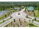 Aerial view of the community roundabout, ponds, landscaping, and residential homes at 14314 17Th E Ct, Parrish, FL 34219