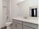 Clean bathroom with shower-tub combo, gray vanity, white countertop, and a large mirror at 14314 17Th E Ct, Parrish, FL 34219