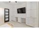 Versatile flex room featuring built-in cabinets, a desk, and ample storage space at 14314 17Th E Ct, Parrish, FL 34219