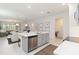 Open-concept kitchen showcases stainless appliances, island with seating, and seamless flow to living areas at 14314 17Th E Ct, Parrish, FL 34219