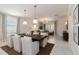 Bright living and dining space showcasing comfortable seating and modern decor at 14314 17Th E Ct, Parrish, FL 34219