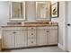 Bright bathroom with double vanity featuring granite countertops and framed mirrors at 14325 Stirling Dr, Lakewood Ranch, FL 34202