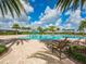 Community pool with lounge chairs, palm trees and splash pad for Gathering enjoyment at 14325 Stirling Dr, Lakewood Ranch, FL 34202