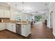 Open-concept kitchen with granite countertops, stainless steel appliances, and seamless flow to living area at 14325 Stirling Dr, Lakewood Ranch, FL 34202