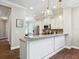 Kitchen with granite countertop, white cabinets, stainless steel appliances, and dark wood flooring at 14325 Stirling Dr, Lakewood Ranch, FL 34202