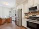 Open kitchen features stainless steel appliances, and a breakfast nook with views of the outside at 14325 Stirling Dr, Lakewood Ranch, FL 34202